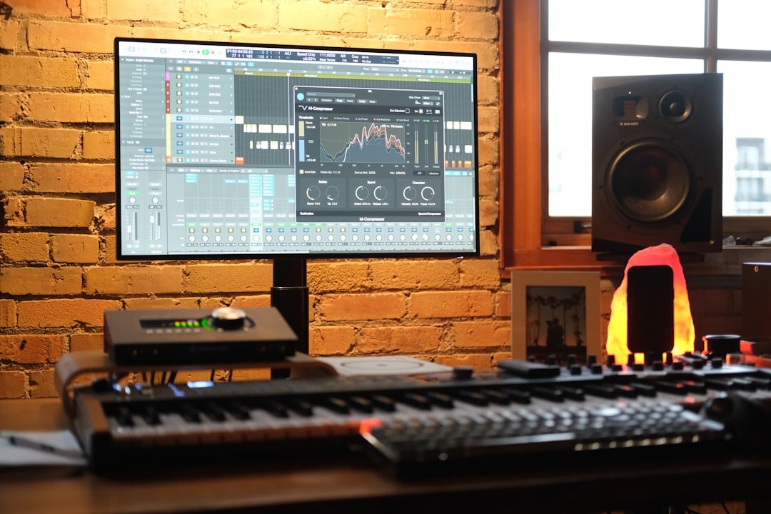 Home music recording studio interior with mixing console and instruments